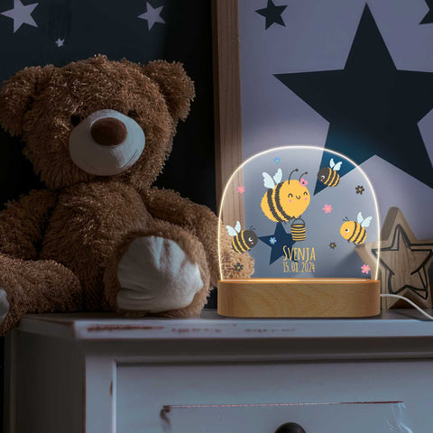 Dziecięca lampka nocna LED z drewnianą podstawką, wzór pszczółka