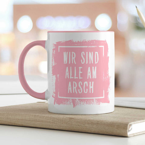 Bedruckte Tasse mit Spruch - "Wir sind alle am Arsch"